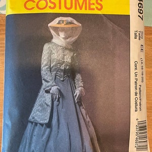 May include: A vintage McCall's Costumes sewing pattern for a blue and white dress with a matching hat. The pattern number is M4697 and the size is EE (14-16-18-20).
