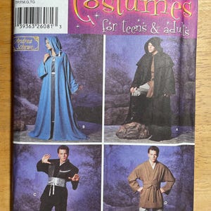 May include: Simplicity costume pattern featuring four costume designs for teens and adults. The designs include a hooded robe, a black cloak, a martial arts outfit, and a brown robe with a belt. The pattern includes sizes XS, S, M, L, and XL.