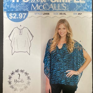 May include: McCall's sewing pattern for a top, featuring a woman wearing a blue and black patterned top. The pattern includes a line drawing of the top, the text "IT'S Sew SIMPLE", and "MADE IN USA".