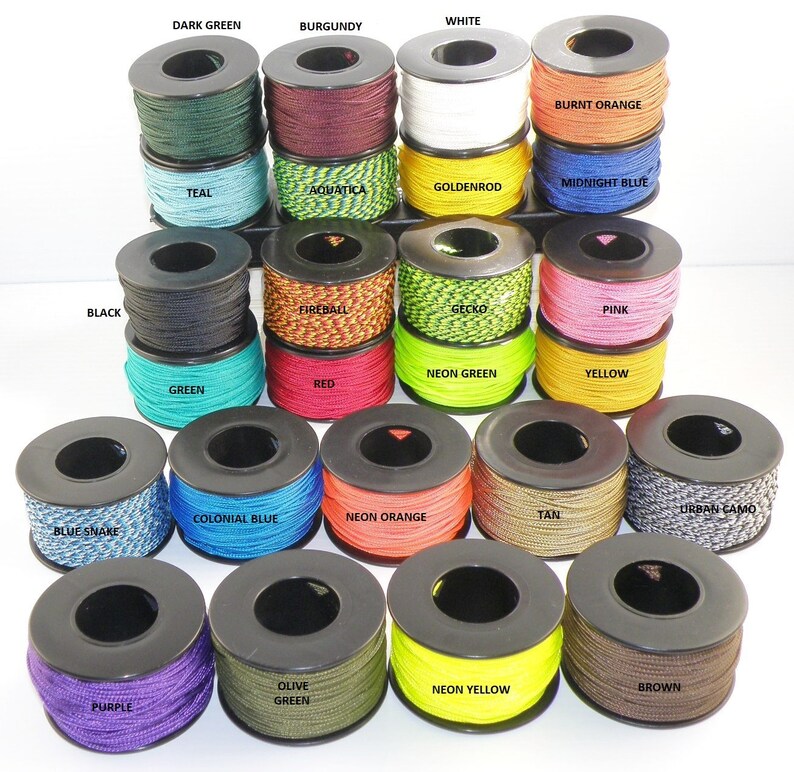 May include: A collection of spools of paracord in various colors, including black, white, dark green, burgundy, burnt orange, teal, aquatica, goldenrod, midnight blue, fireball, gecko, pink, neon green, yellow, red, green, colonial blue, neon orange, tan, urban camo, blue snake, olive green, neon yellow, brown, and purple.