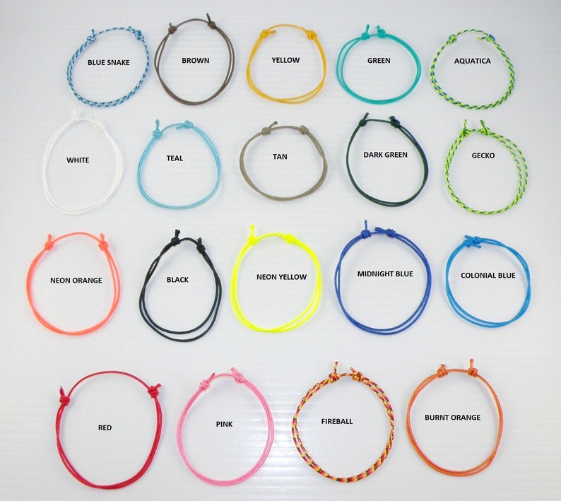 May include: A collection of 20 colorful braided bracelets, each with a different color and name. The bracelets are arranged in four rows of five, with the names of each bracelet printed below them. The colors include blue, green, yellow, orange, red, pink, brown, black, white, teal, tan, dark green, and more.