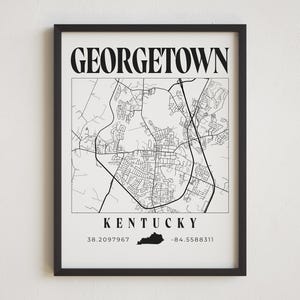 May include: Black and white map print of Georgetown, Kentucky with the city name and coordinates at the bottom. The map shows the streets and roads of the city.