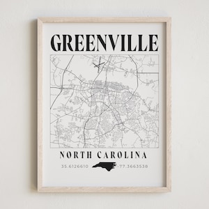 May include: Black and white map print of Greenville, North Carolina with the city name and state name in bold text. The coordinates 35.6126610, -77.3663538 are listed below the state name.