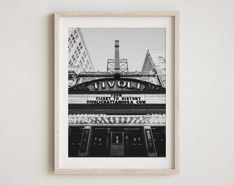 May include: Black and white photograph of the Tivoli Theatre in Chattanooga, Tennessee. The marquee reads "Your Ticket to History TivoliChattanooga.com".
