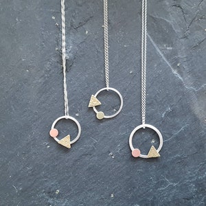 Abstract, geometric circle and triangle pendant. Modern mixed metal necklaces.