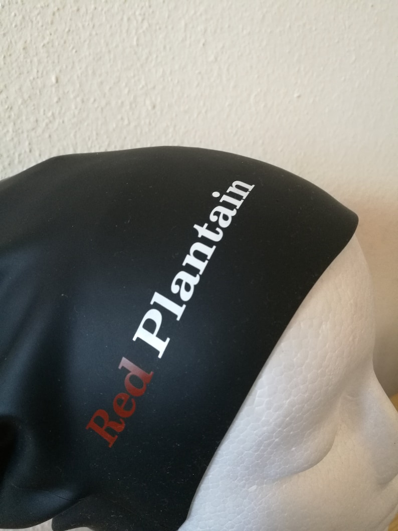 May include: Black silicone swim cap with the text "Red Plantain" in white letters.