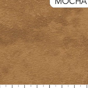 May include: A close-up of a brown fabric with a textured, slightly mottled appearance. The fabric is labeled "MOCHA".