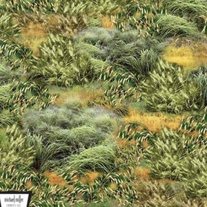 May include: A close-up of a fabric with a repeating pattern of green, brown, and yellow grasses. The fabric is measured in inches.