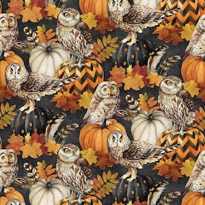 May include: A fabric pattern featuring brown and white owls perched on orange, white, and black chevron pumpkins, interspersed with colourful autumn maple leaves and brown feathers against a dark charcoal grey background.