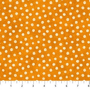 May include: Orange fabric with a white polka dot pattern. The dots are of varying sizes and are scattered randomly across the fabric.