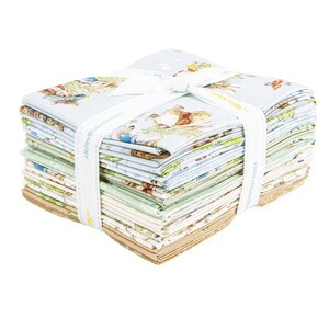 May include: A bundle of fabric squares, secured with a white ribbon. The fabric has a light blue base with animal illustrations. The ribbon is printed with the words "Riley Blake Designs".