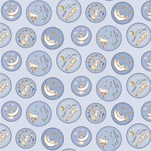 May include: A blue and white fabric with a repeating pattern of bunnies sleeping under the moon. The bunnies are holding a small star and the text "Sleeping under the bright moon" is written on a banner above them. The text "Little Nuthrown Hare" is written on a banner below the bunnies.