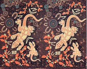 May include: A black fabric with a repeating pattern of orange, yellow, and blue lizards, circles, and dots. The fabric has a ruler at the bottom with inches marked.