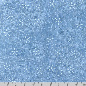 May include: A blue fabric with a white floral pattern. The flowers are outlined with white dots.