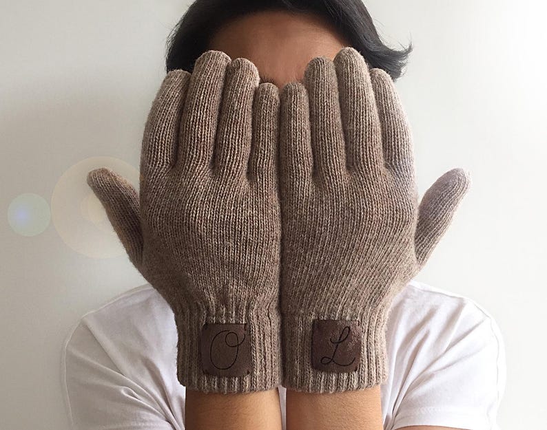 Tan gloves with the laser cut initials on faux leather sewn on the cuffs. Please let me know 2 initials you want. The first letter you mention will be applied on the left and the second letter will be applied on the right wrist.