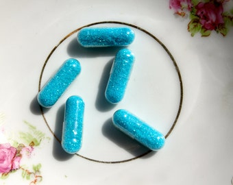 Glitter Pills in Pool Water