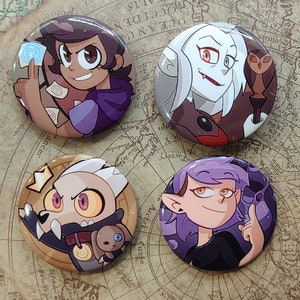 May include: Four round button pins featuring characters from the animated series The Owl House. The pins are colorful and feature the characters Luz, Eda, King, and Amity.