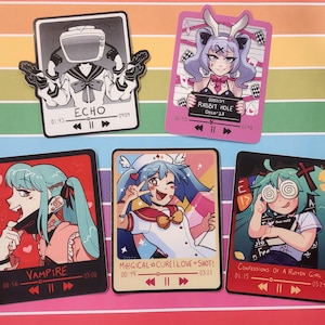 May include: Set of ten stickers featuring anime-style characters with different themes. Each sticker has a black border and a music player design with play, pause, and skip buttons. The stickers include titles like "Echo", "Vampire", "Rabbit Hole", "Magical Cure! Love Shot!" and "Confessions of a Rotten Girl".