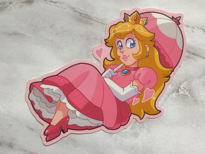 May include: A pink and white cartoon character with blonde hair and a crown, wearing a pink dress and holding a pink and white mushroom umbrella. The character is surrounded by pink hearts.