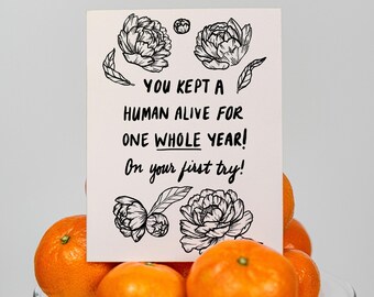 Grappige kaart voor ouders eerste verjaardag van baby