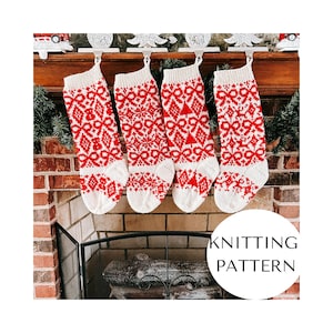 May include: Four red and white knitted Christmas stockings with a geometric pattern hang from a mantel. The stockings are displayed in front of a brick fireplace. The text "KNITTING PATTERN" is in a white circle.