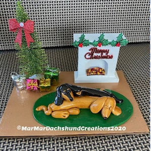 Relaxing by the fireplace Christmas Doxie/Dachshund figurine