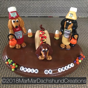 Trick or treating with the hot dogs Dachshund/Doxie figurine. (International shipping available)