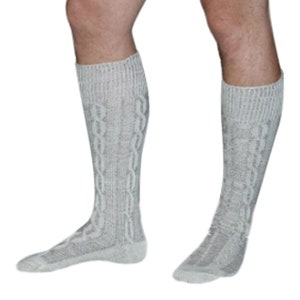 May include: A pair of gray knee-high socks with a cable knit pattern.