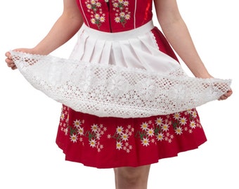 May include: A red dirndl dress with white lace trim and a white apron. The dress has a floral pattern and a red ribbon at the neckline.