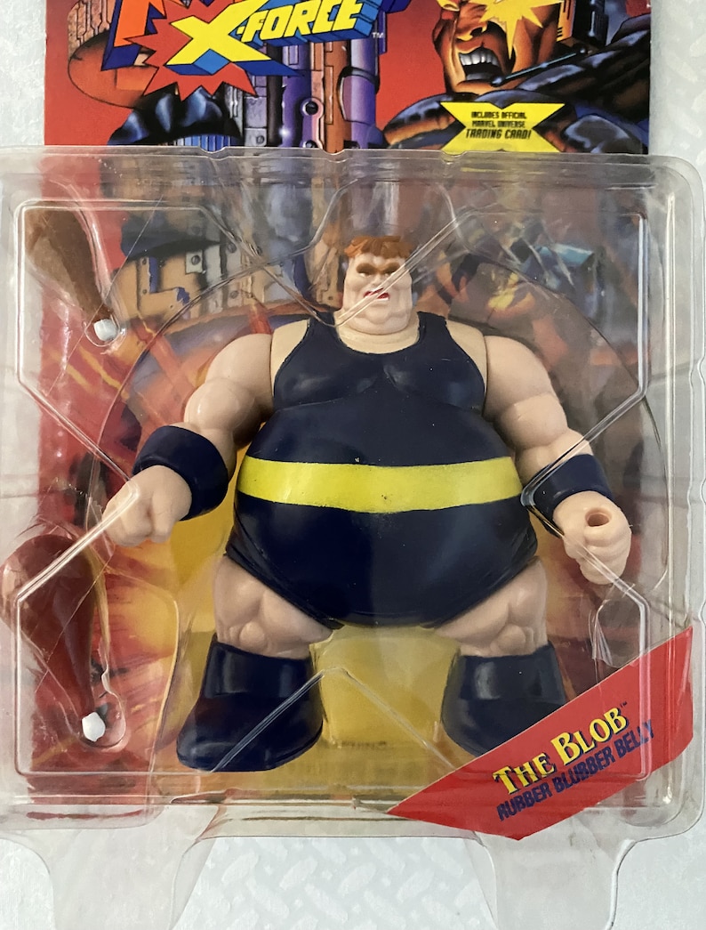 May include: A blue and yellow action figure of The Blob from the X-Force comic book series. The figure has a rubber belly and comes with a trading card.