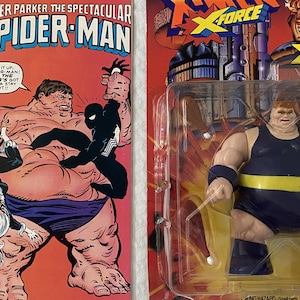 May include: A vintage comic book featuring Spider-Man battling the Blob. The comic book cover is red and features a black and white illustration of Spider-Man fighting the Blob. The comic book is titled "Peter Parker, The Spectacular Spider-Man" and is issue number 91.  The comic book is next to a plastic-wrapped action figure of the Blob. The action figure is wearing a blue and yellow costume and is holding a pair of white nunchucks. The action figure is packaged in a plastic blister pack with a red, yellow, and black background. The packaging includes the text "X-Force" and "The Blob".