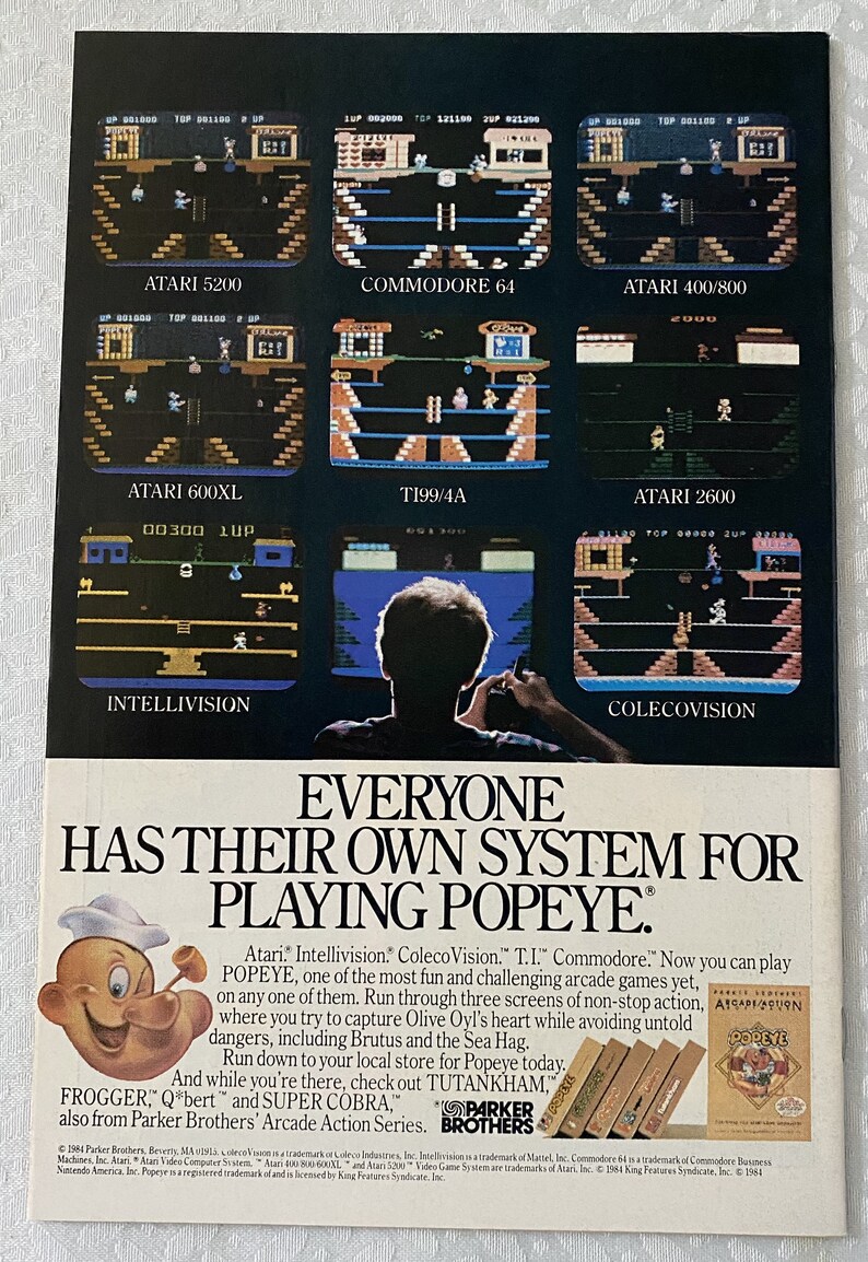 May include: A vintage advertisement for the Popeye video game, featuring screenshots of the game on different gaming consoles, including Atari, Intellivision, ColecoVision, T.I., Commodore, and Atari 2600. The ad features the iconic Popeye cartoon character and the text "Everyone has their own system for playing Popeye."