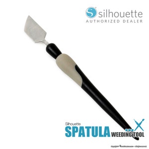 May include: A black and gray weeding tool with a gray handle and a silver spatula blade. The tool is labeled "Silhouette SPATULA WEEDING TOOL".