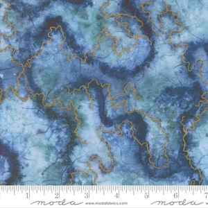 May include: Blue and teal fabric with a watercolour effect, featuring gold-coloured, meandering lines. The fabric has a mottled appearance with darker blue areas and lighter teal sections. The design is reminiscent of a map or a flowing river.