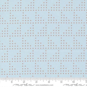 May include: A light blue fabric with a repeating pattern of small brown dots arranged in a grid.