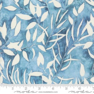 May include: Blue fabric with a watercolour effect, featuring white leaf and stem patterns. A ruler is along the bottom edge, with the word "moda" printed on it.