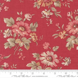 May include: Red fabric with a floral design. The pattern showcases large flowers in pink, peach, and cream, with green and tan leaves. The fabric has a textured look and a ruler is at the bottom.