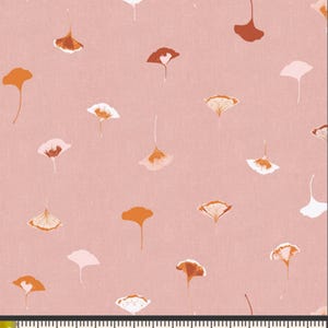 May include: A pink fabric with a repeating pattern of white, orange, and brown ginkgo leaves. The fabric is textured and has a subtle sheen.