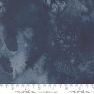 May include: A dark blue watercolour fabric with a mottled, cloudy pattern. The fabric is textured and has a soft, hand-painted look.