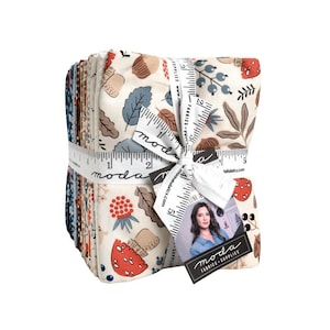 May include: A stack of folded fabric squares tied with a white measuring tape featuring the text moda fabrics. The fabric has a cream background with a repeating pattern of red mushrooms, blue leaves, brown acorns, and berries in various earthy tones.