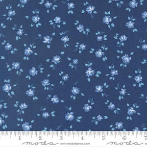 May include: Navy blue fabric with a repeating pattern of small, light blue roses and leaves. The fabric has a floral design, suitable for quilting, sewing, or crafting projects. The fabric is measured in inches.