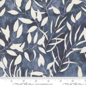 May include: A white fabric with a blue watercolour pattern of leaves. The fabric has a repeating pattern of white leaves on a blue background. The fabric is perfect for quilting, sewing, and crafting.