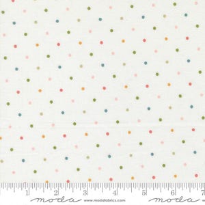 May include: White fabric with a repeating pattern of colorful polka dots in shades of pink, green, blue, and yellow. The fabric has a ruler printed along the bottom edge, with measurements in inches.