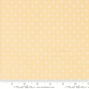 May include: A yellow fabric with a white floral pattern. The fabric has a grid pattern with small white flowers in each square.