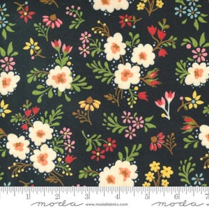 May include: A black fabric with a white, pink, red, and yellow floral pattern. The fabric is from Moda Fabrics.