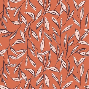 May include: An orange-red botanical pattern featuring stylized leaves and branches. The leaves are a cream color with dark brown outlines, creating a textured, hand-drawn effect. The design is a repeating pattern, suitable for fabric or wallpaper.