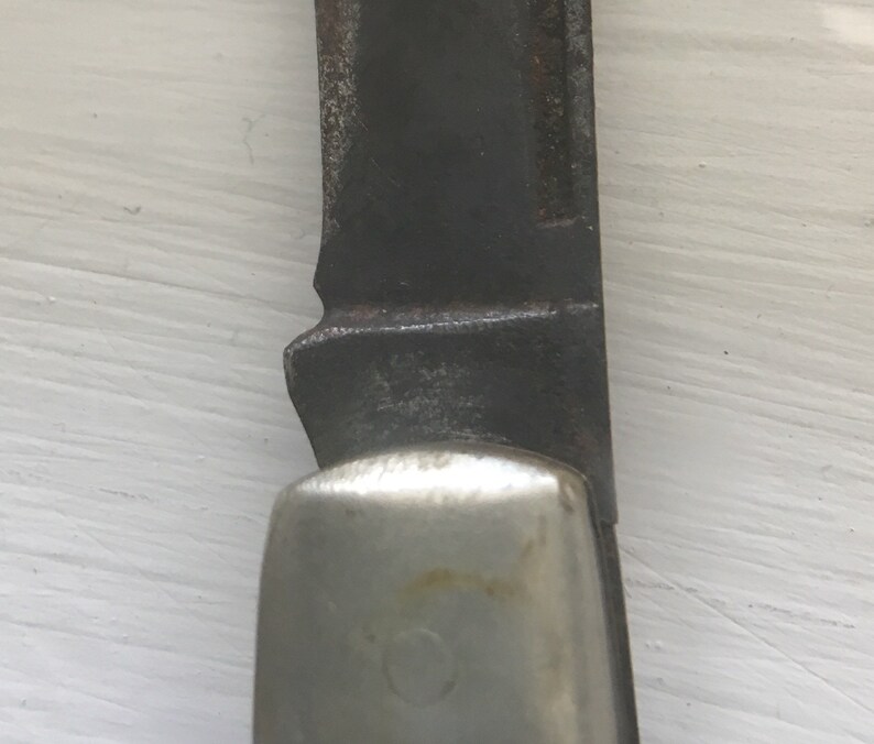 Set of 3 knives Sabre Revlon Pocket Knives and one that is not Marked