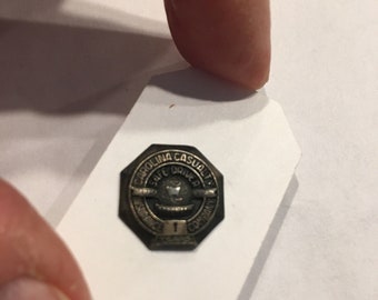 Vintage Sterling Carolina Casualty Insurance Company Safe Driver 1 year lapel pin.