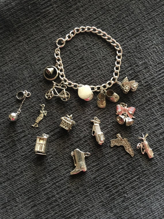 F.C.C. Sterling Charm Braclet with 14 Sterling Cha
