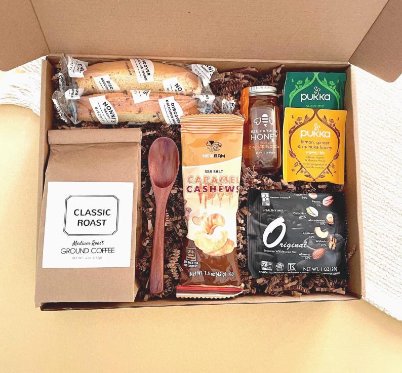 Real Etsy listing photograph of a coffee and tea gift box with honey, biscotti and treats